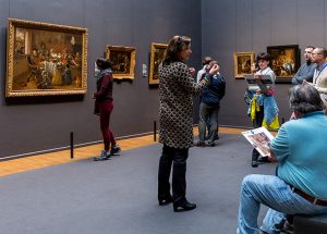 Anna discussing ‘The Merry Family’ by Jan Steen.